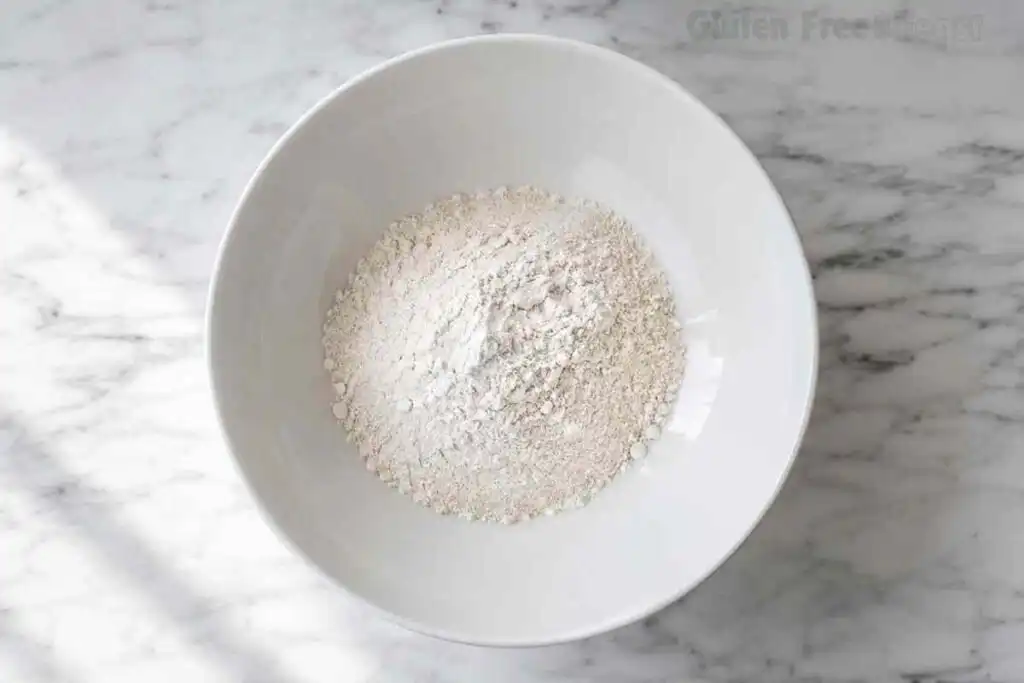 Gluten-free flour mixture in a white bowl for homemade pasta