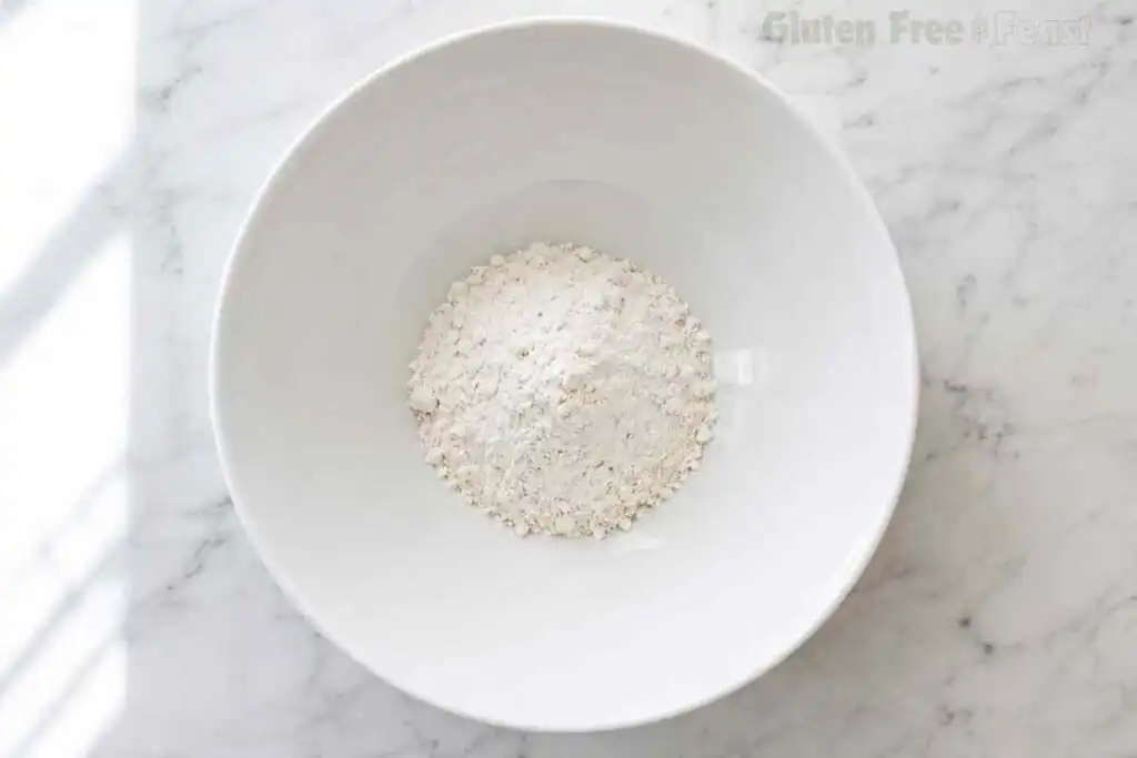 Soft homemade gluten free pie dough mixed until combined and ready for chilling before rolling.