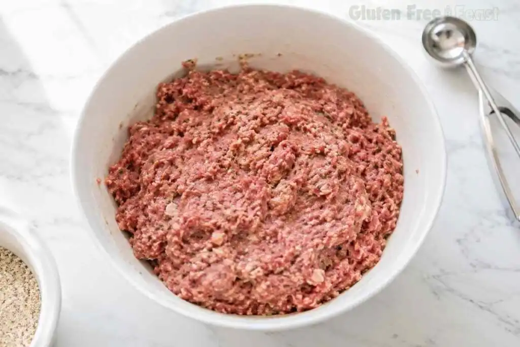Fully combined gluten free meatball mixture in a white bowl