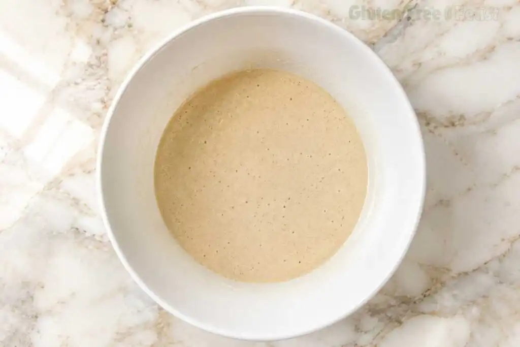 Smooth, thick gluten-free pancake batter after the essential 5-minute resting step to fully hydrate the starches.