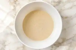 Smooth, thick gluten-free pancake batter after the essential 5-minute resting step to fully hydrate the starches.