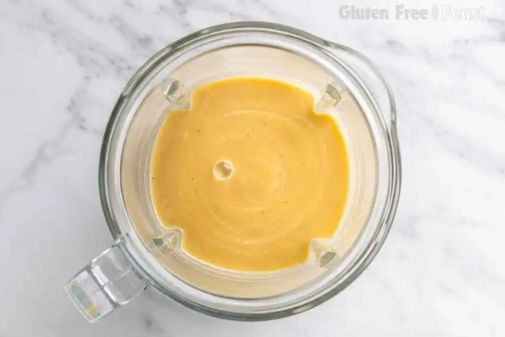 Smooth blended gluten free potato soup in a blender jar