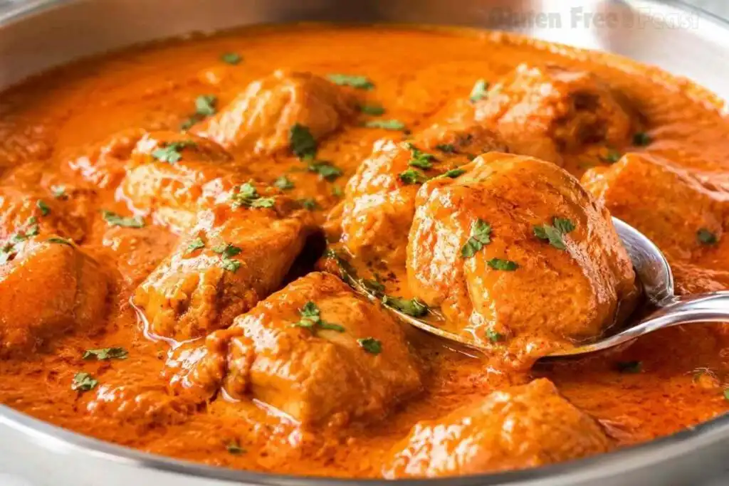 Close-up of creamy dairy-free butter chicken with cilantro in a skillet