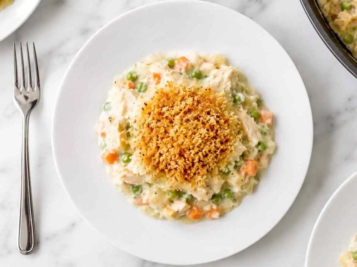 Top-down view of gluten free crustless chicken pot pie with crispy breadcrumb topping
