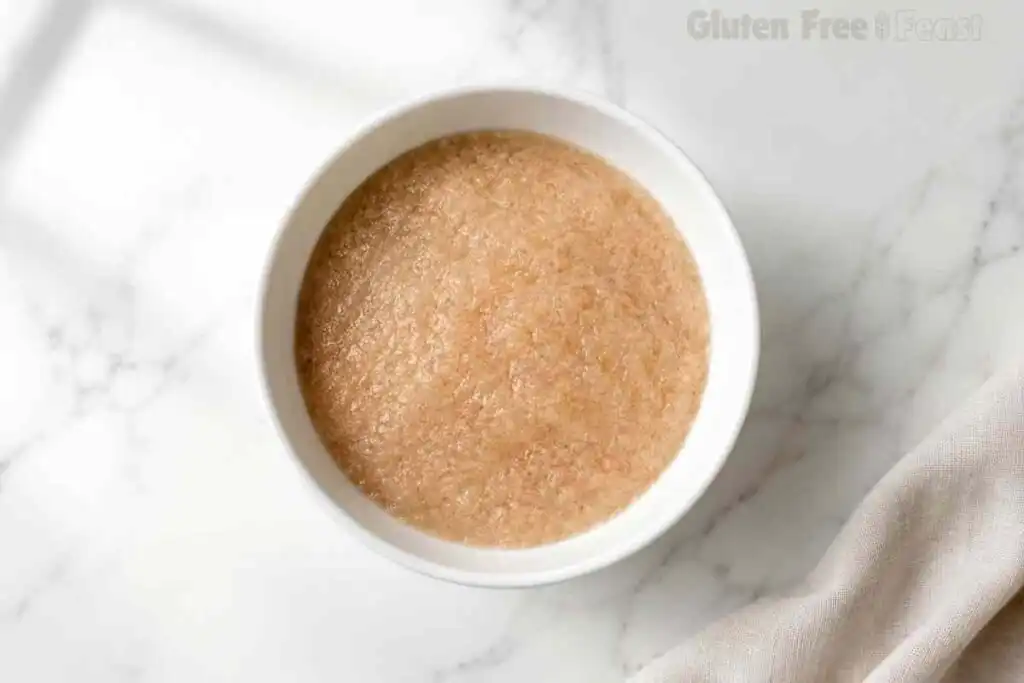 Hydrated psyllium gel in a white bowl for gluten free sourdough bread.